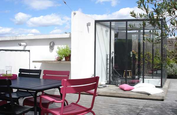 Transformation d'un toit en terrasse végétalisée style Loft par un architece paysagiste à Lyon